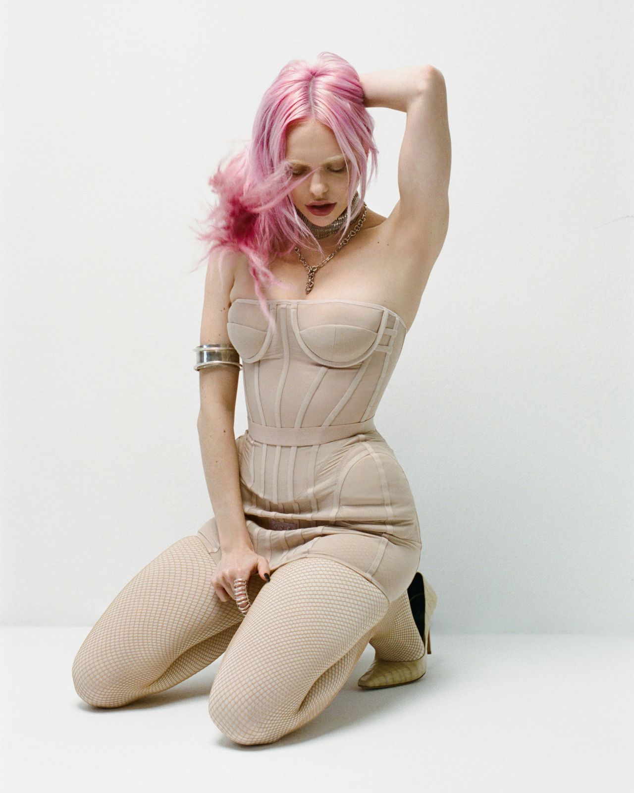 adela-for-nylon-january-2026-beige-corset-black-fringe-urban-sheer-11