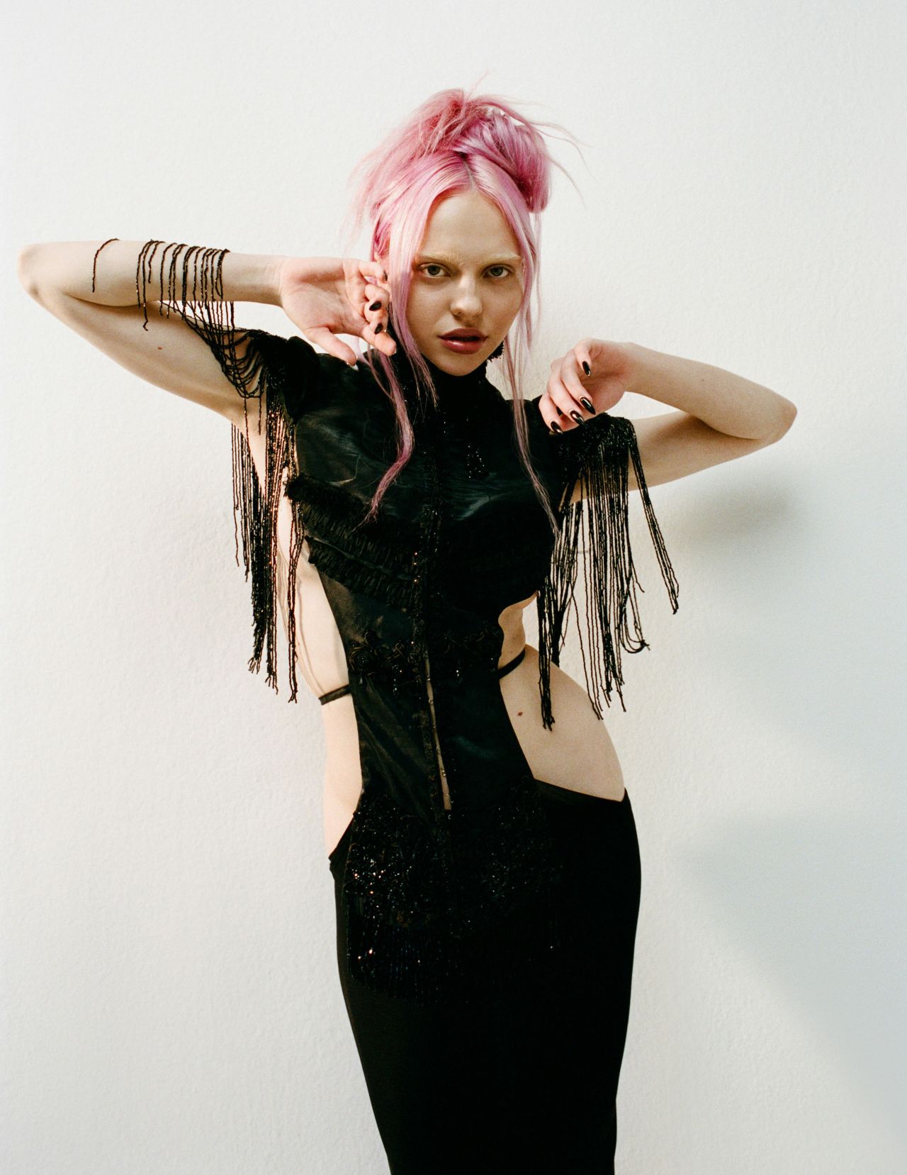 adela-for-nylon-january-2026-beige-corset-black-fringe-urban-sheer-6